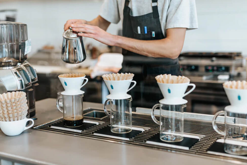 A person making coffee